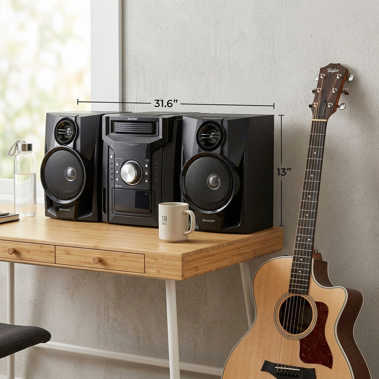Sharp CD-BH950 5-disc stereo system on a wooden desk next to a guitar, measuring 31.6"w x 13"h.