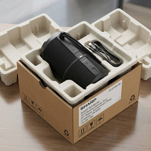 Sharp GX-BT290-BK portable speaker in eco-friendly molded pulp tray and recyclable cardboard box.