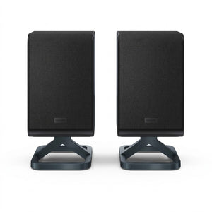 Pair of black Sharp HT-SPR52021-BK wireless rear surround speakers on modern stands, pure white background.